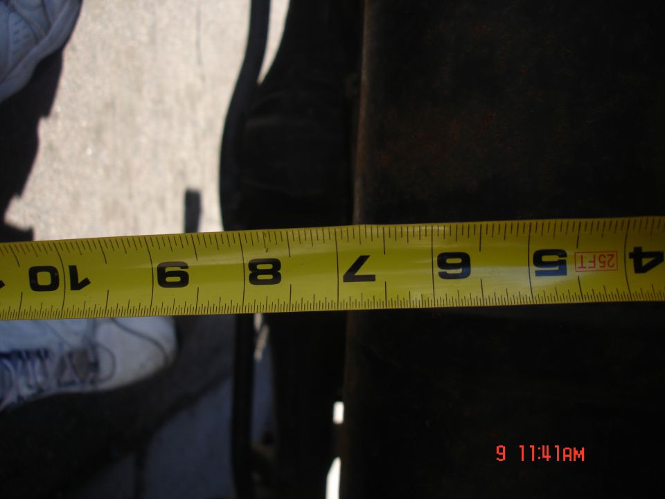 Yellow measuring tape showing 5 inches against a dark surface