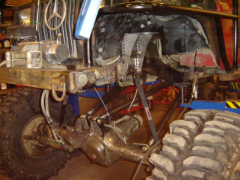 1992 Ford Bronco - Custom off-road vehicle chassis a winch, heavy-duty suspension, and oversized tires.