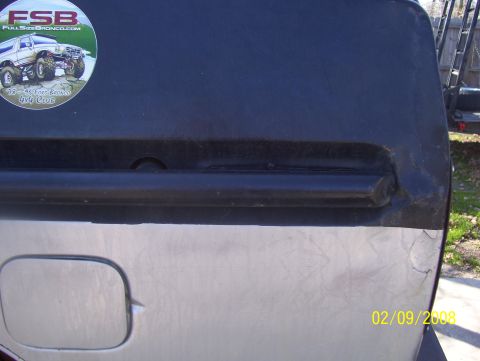 1978 Ford Bronco - A close-up view of a vehicle's rear quarter panel and fuel door, a sticker for "FSB Full Size Bronco 4x4 Club".