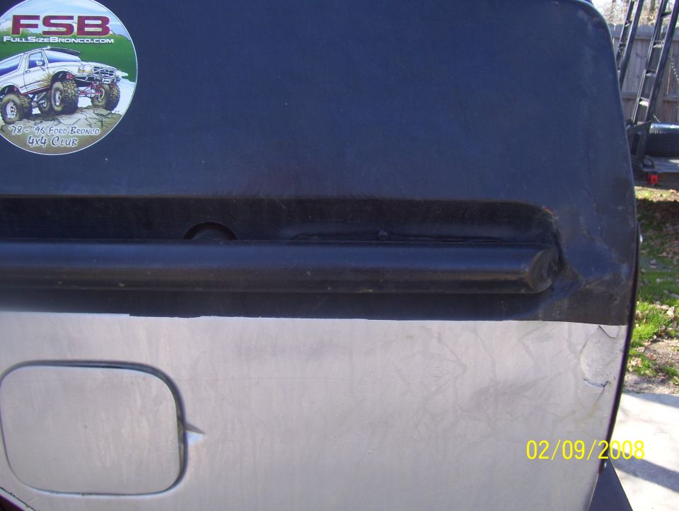 Rear quarter panel and fuel door of a vehicle with a "FSB Full Size Bronco" sticker