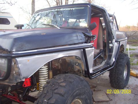 1978 Ford Bronco - This heavily modified truck features oversized tires and a custom roll cage, indicating it's built for off-road use.