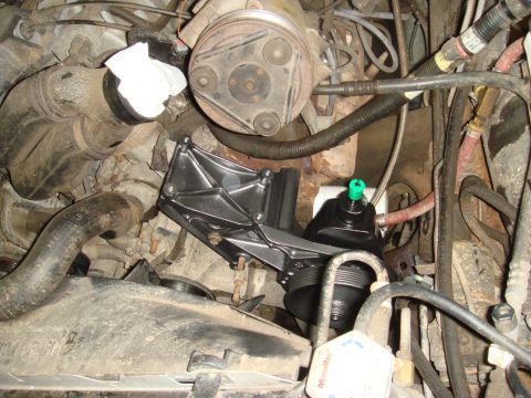 1996 Ford Bronco - New power steering pump and bracket installed in the engine bay.
