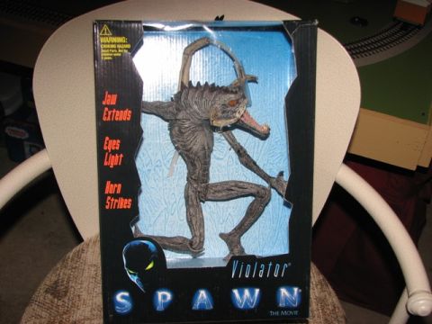 1991 Ford Bronco - Spawn Violator action figure in its original packaging, text about its features.