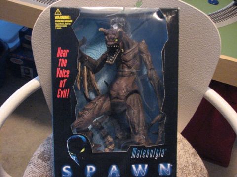 1991 Ford Bronco - Spawn Malebolgia action figure in box, with text 'Hear The Voice of Evil!' visible.