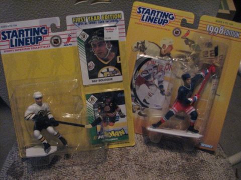 1991 Ford Bronco - Two Starting Lineup hockey action figures, one of Ray Bourque and another of Brian Leetch, are displayed in their original packaging.