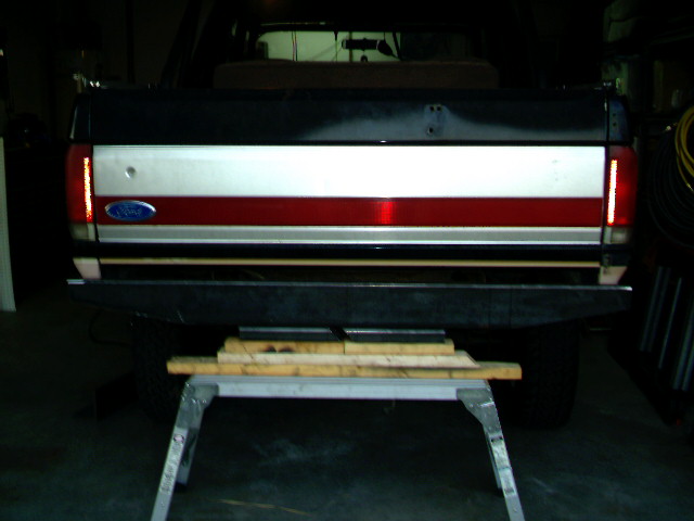 1989 Ford Bronco rear bumper and tailgate with red, white, and silver stripe
