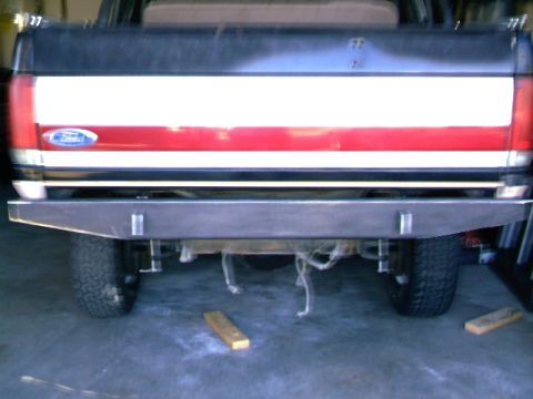 1989 Ford Bronco - Rear view of a 1989 Ford Bronco showing its tailgate and a custom metal bumper.