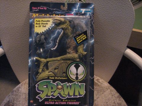 1991 Ford Bronco - Spawn action figure in packaging, advertised as a Deluxe Edition Ultra-Action Figure.