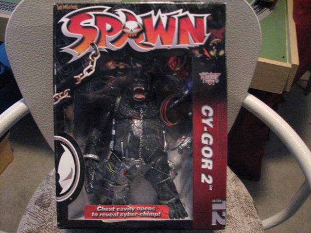 Spawn toy packaging for CY-GOR 2, showing a figure inside, with text about a cyber-chimp