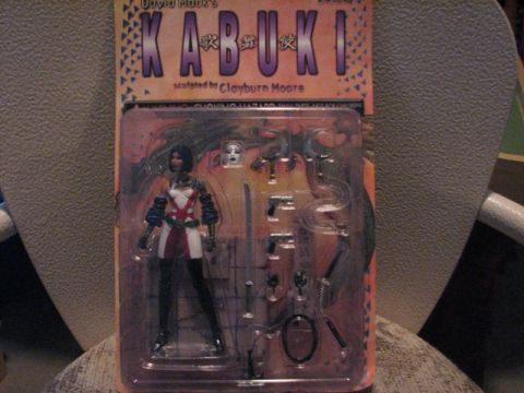 1991 Ford Bronco - Action figure of Kabuki, sculpted by Clayburn Moore, is displayed in its original packaging.