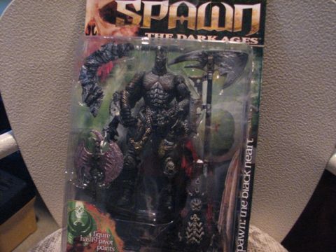 1991 Ford Bronco - A Spawn action figure is displayed in its original packaging, showing the character and game title.