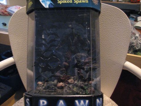 1991 Ford Bronco - A Spawn toy display case with figures and skulls is shown. The text 'Spiked Spawn' is visible.