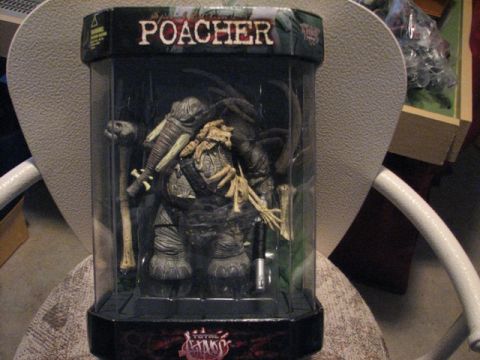 1991 Ford Bronco - A toy figure, labeled "POACHER", is displayed in its original packaging.