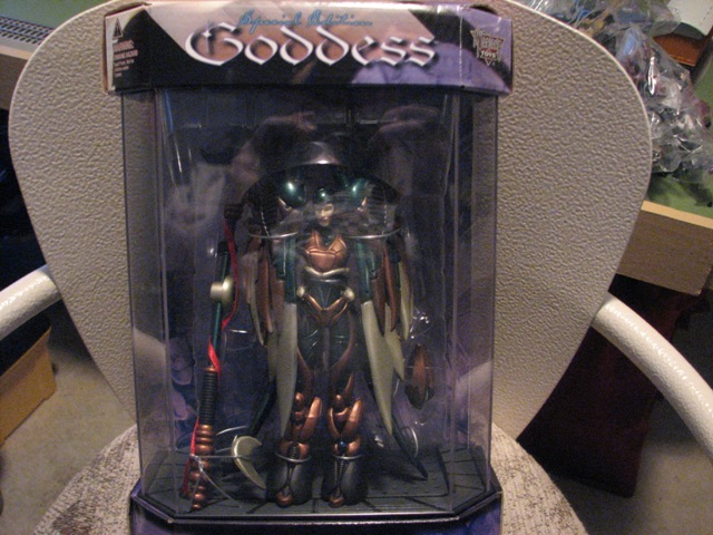 Action figure in a clear plastic box with 'Goddess' on top