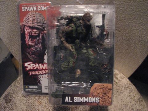 1991 Ford Bronco - Spawn action figure in its original packaging, labeled 'Al Simmons'.