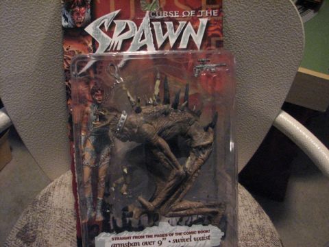 1991 Ford Bronco - Spawn action figure in packaging, with text indicating 'armspan over 9" - swivel waist'.