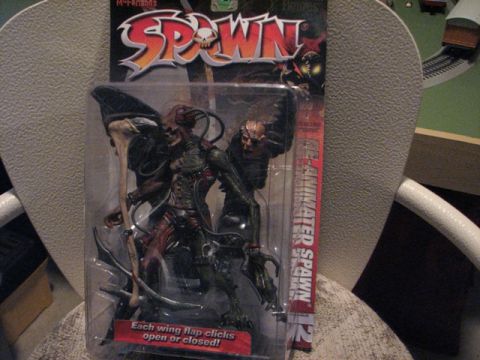 1991 Ford Bronco - A Spawn action figure is displayed in its original packaging, with text indicating interactive features.