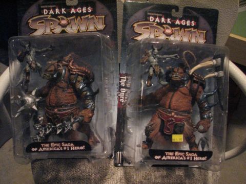 1991 Ford Bronco - Two Spawn action figures from the 'Dark Ages' series are displayed in their original packaging.