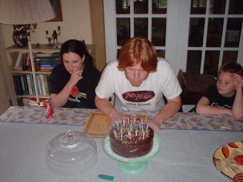 1996 Ford Taurus - A birthday celebration with a cake and family members.