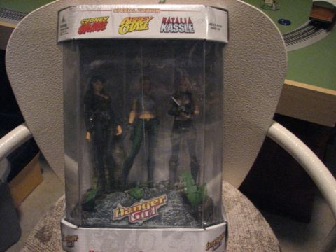 1991 Ford Bronco - Danger Girl action figures are displayed in their special edition packaging.