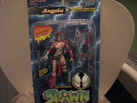 1991 Ford Bronco - Action figure of Angela from Spawn, packaged with weapons and accessories. Text indicates it is a limited edition.