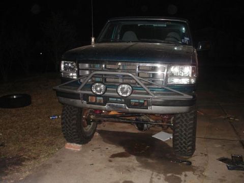 1996 Ford F-150 - This 1996 Ford F-150 features a custom front bumper with auxiliary lights, enhancing its appearance.