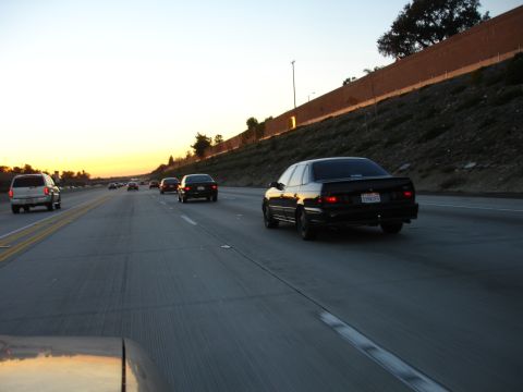 1991 Ford Taurus - Driving a 1991 Ford Taurus on the highway as the sun sets.