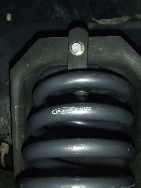 1996 Ford Bronco - Close-up of a DEAVER 1153C suspension coil spring, likely for a vehicle modification.