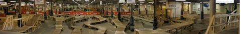 1997 Ford Probe - An expansive indoor skate park features intricate wooden ramps and pathways, suggesting a recreational facility.