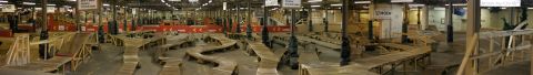 1997 Ford Probe - An indoor RC car track features a complex layout of wooden ramps and obstacles, suggesting a dedicated hobby space.