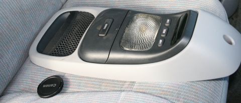 1996 Ford Bronco - Overhead console unit with interior lighting and control buttons, likely from a vehicle.