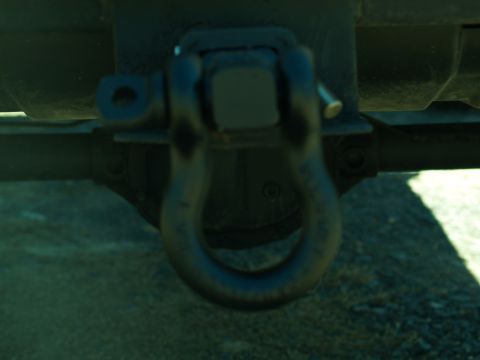 1989 Jeep Cherokee - Close-up of a tow hitch shackle attached to a vehicle's frame.