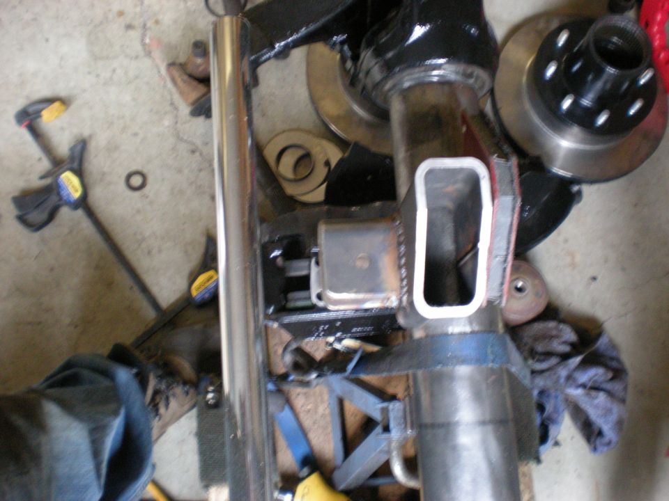Close-up of a modified vehicle axle assembly with brake rotor and hub visible