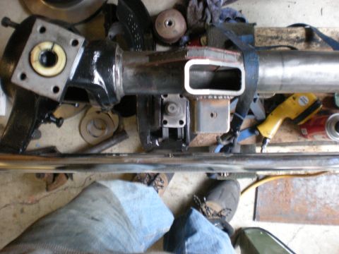 1993 Ford Bronco - Close-up view of a front axle assembly, likely undergoing modification or repair, with various components and tools visible.