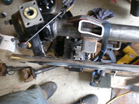 1993 Ford Bronco - Close-up of automotive axle components and differential housing with custom fabrication.