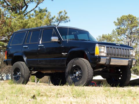 1989 Jeep Cherokee - Modified 1989 Jeep Cherokee with off-road tires and suspension lift.