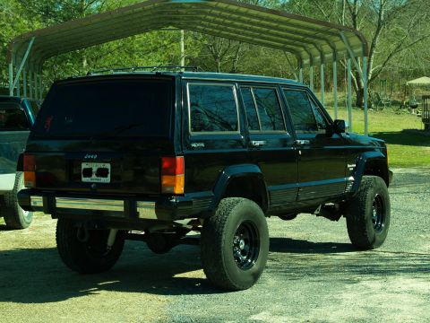 1989 Jeep Cherokee - This black Jeep Cherokee appears to be from the 1984-2001 model range, not a 1989.