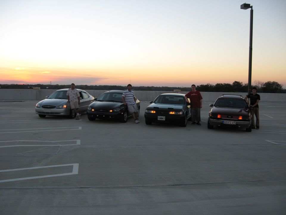 Silver 2002 Ford Taurus parked at sunset