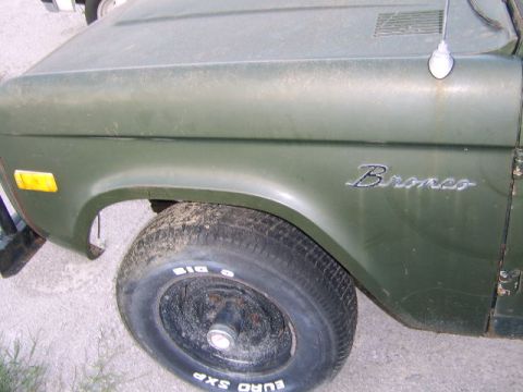 1986 Ford Ranger - Close-up of a 1978 Ford Bronco's side fender and wheel, showing the 'Bronco' emblem.