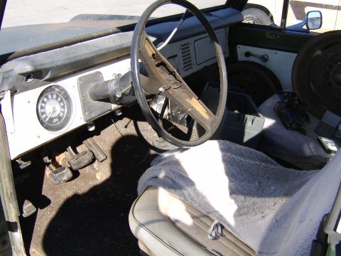1986 Ford Ranger - The interior of this vehicle shows a worn dashboard, steering wheel, and seats, with a visible speedometer.