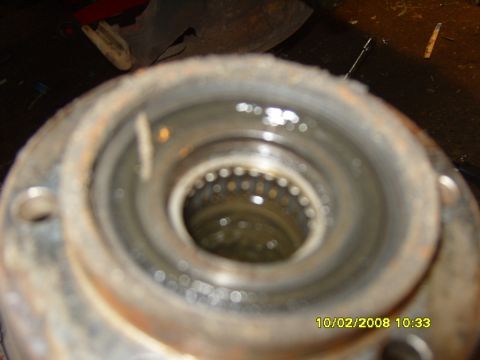 1989 Ford Bronco - Close-up view of a spindle bearing assembly, showing the internal roller bearings and lubricant.
