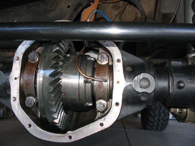 Open rear differential showing ring gear and carrier with cover removed