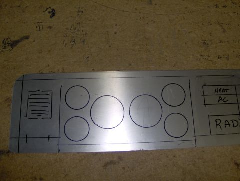 1978 Ford Bronco - A metal panel is marked with outlines for gauges and labels for climate controls and the radio, likely a custom or replacement part.