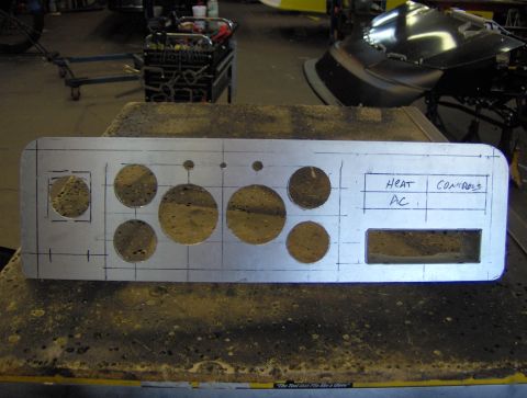 1978 Ford Bronco - An unfinished aluminum dashboard panel is laid out with markings for gauge and control placements.