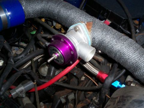 1994 Ford Probe - A close-up view of a turbo blow-off valve, part of a vehicle's engine system.