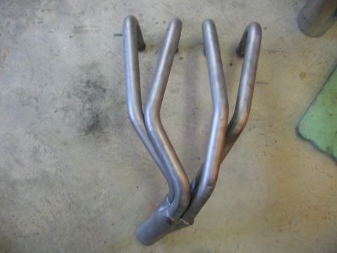 1985 Ford LTD Crown Victoria - Exhaust manifold on a concrete floor.