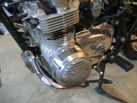 1985 Ford LTD Crown Victoria - Close-up view of a motorcycle's engine and exhaust system.