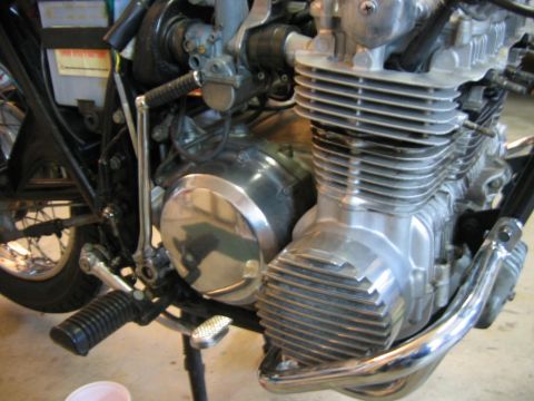 1985 Ford LTD Crown Victoria - Detailed view of a motorcycle's engine, showing its mechanical components and metallic finish.