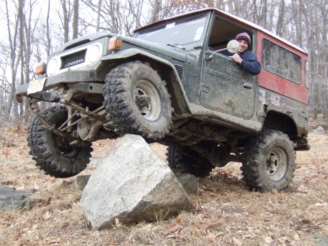 1976 Toyota Land Cruiser - This 1976 Toyota Land Cruiser is shown navigating a rocky trail, demonstrating its off-road capabilities.