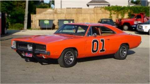 1990 Ford Bronco - This orange Dodge Charger, famous for its role in The Dukes of Hazzard, is seen here from a three-quarter front view.